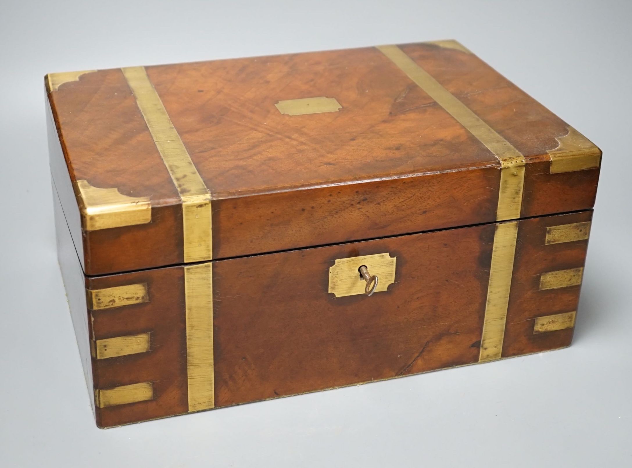 A Victorian mahogany brass bound writing slope with key - 16cm high